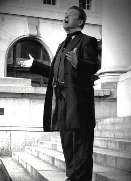 Richard Jones in Victorian costume guides his Dickens Christmas walk.