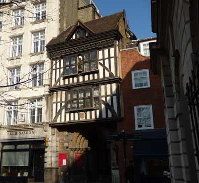 The black and white timbered gatehouse of the church of St Bartholomew the Great.