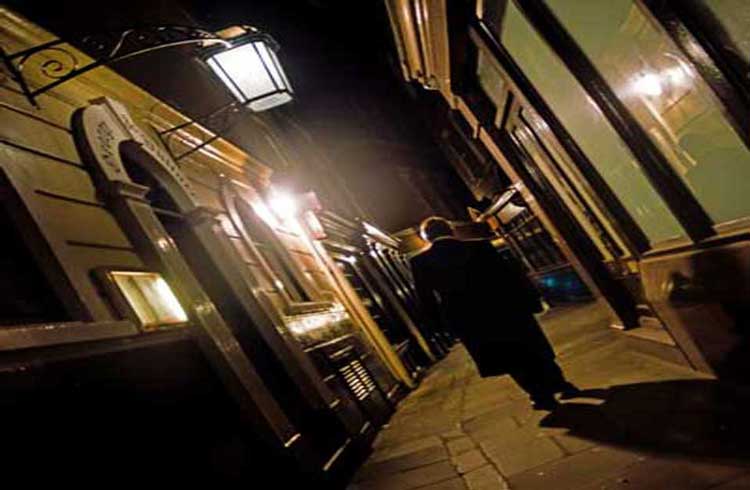 Richard walking through a haunted alley.