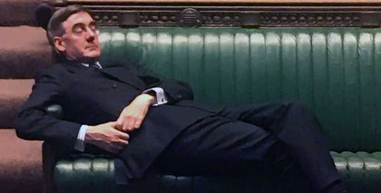 Jacon Rees-Mogg reclining in the House of Commons.