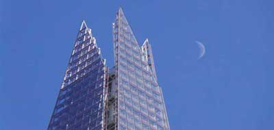 The Shard with the moon beside it.