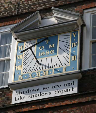 The Sundial in Pump Court Temple. It reads Shadows We Are And Like Shadows Depart.