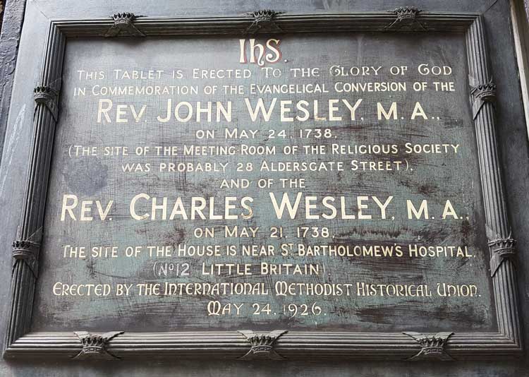 The board commemorating the conversions of John and Charles Wesley.