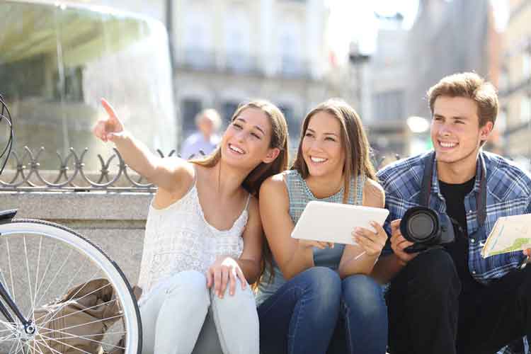 Three people solving a clue on the Quiz Trail.