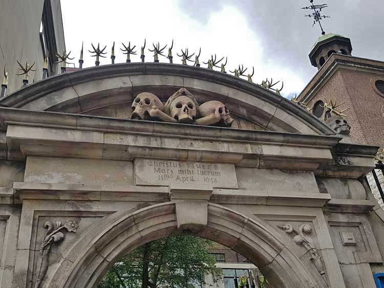 The skulls over the gate of St Olave's Church.