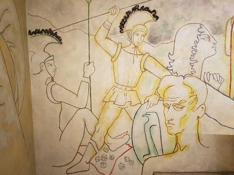 The mural with Jean Cocteau and Roman soldiers with dice.