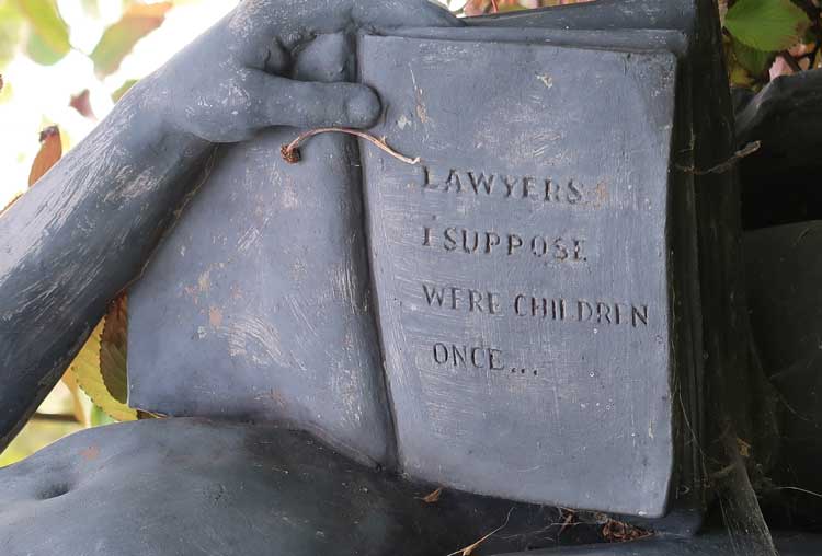 The book with the quote Lawyers I suppose were children once written on it.