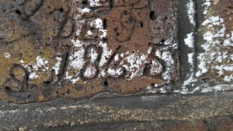 December 9th 1865 carved into a brick on the wall..