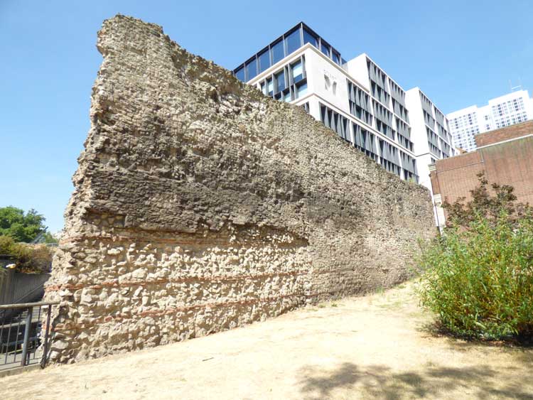 The segment of the old London city wall on Tower Hill seen from the east.