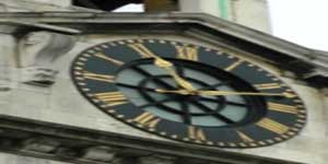 The black clock face of St George the Martyr.