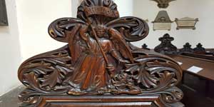 The carving on the Church Warden's pew in St Michael's Church.