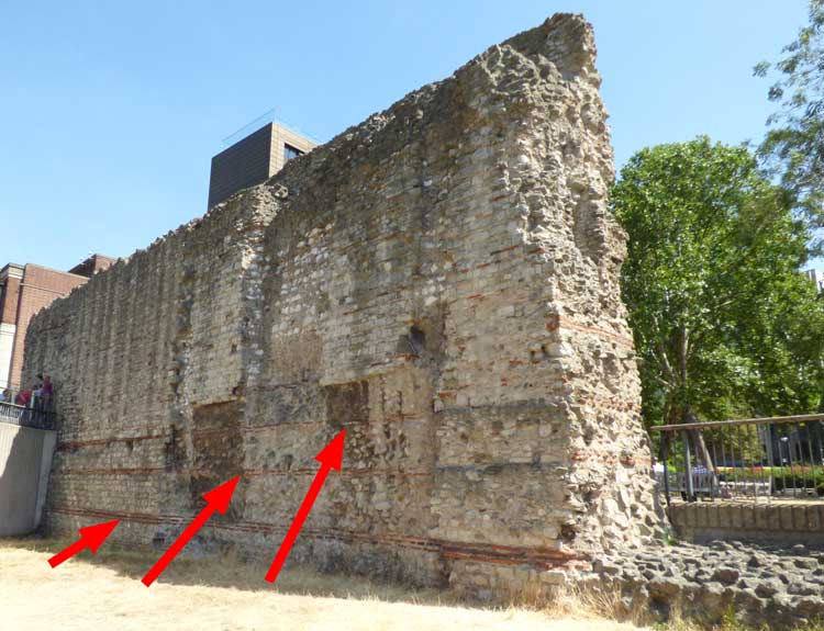 The segment of the old London city wall on Tower Hill seen from the east.